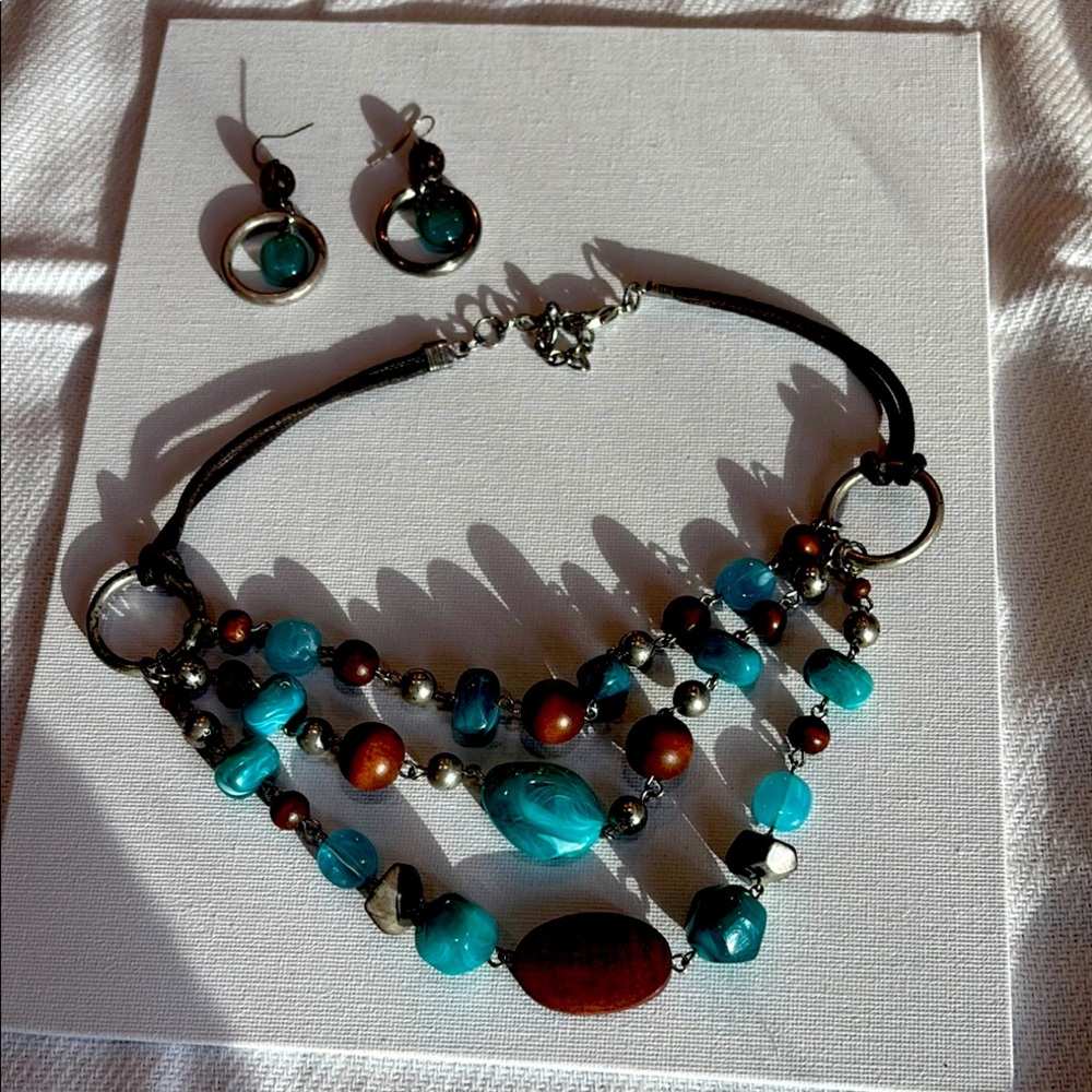Triple strand necklace and earrings by Premier jewelry